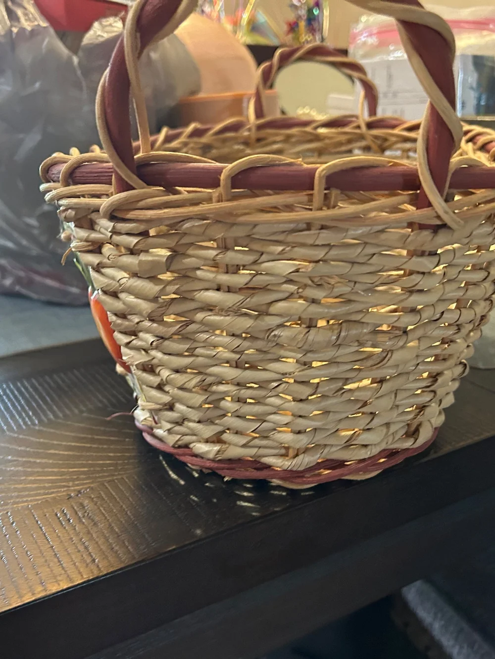 vintage woven wicker basket features hand-painted ceramic fruit tiles.